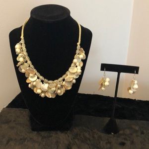 Shell and pearl necklace and earrings.
